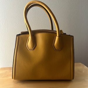 ALDO purse. Yellowish gold color. With detachable adjustable strap. New no tags.